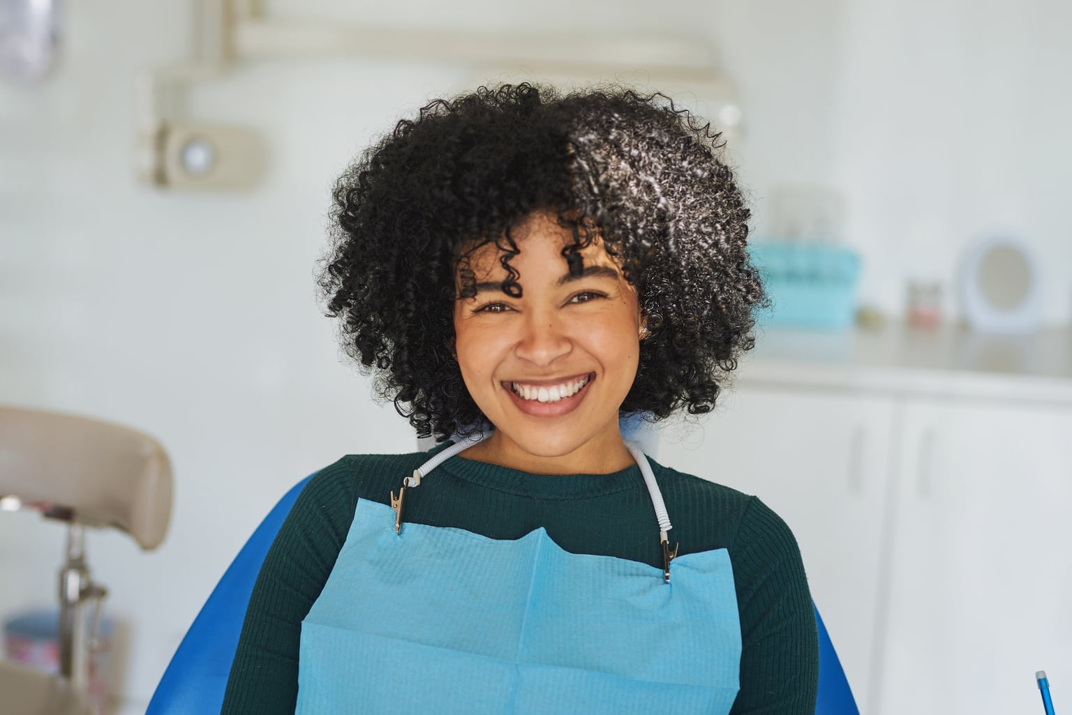 Adult patient seated in a dental treatment chair